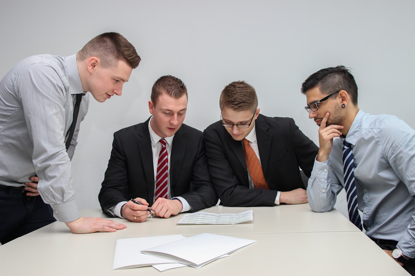 Business leaders reviewing a strategy together at a table